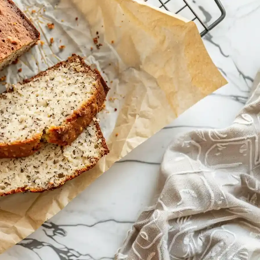 Sliced cottage cheese banana bread loaf on cooling rack