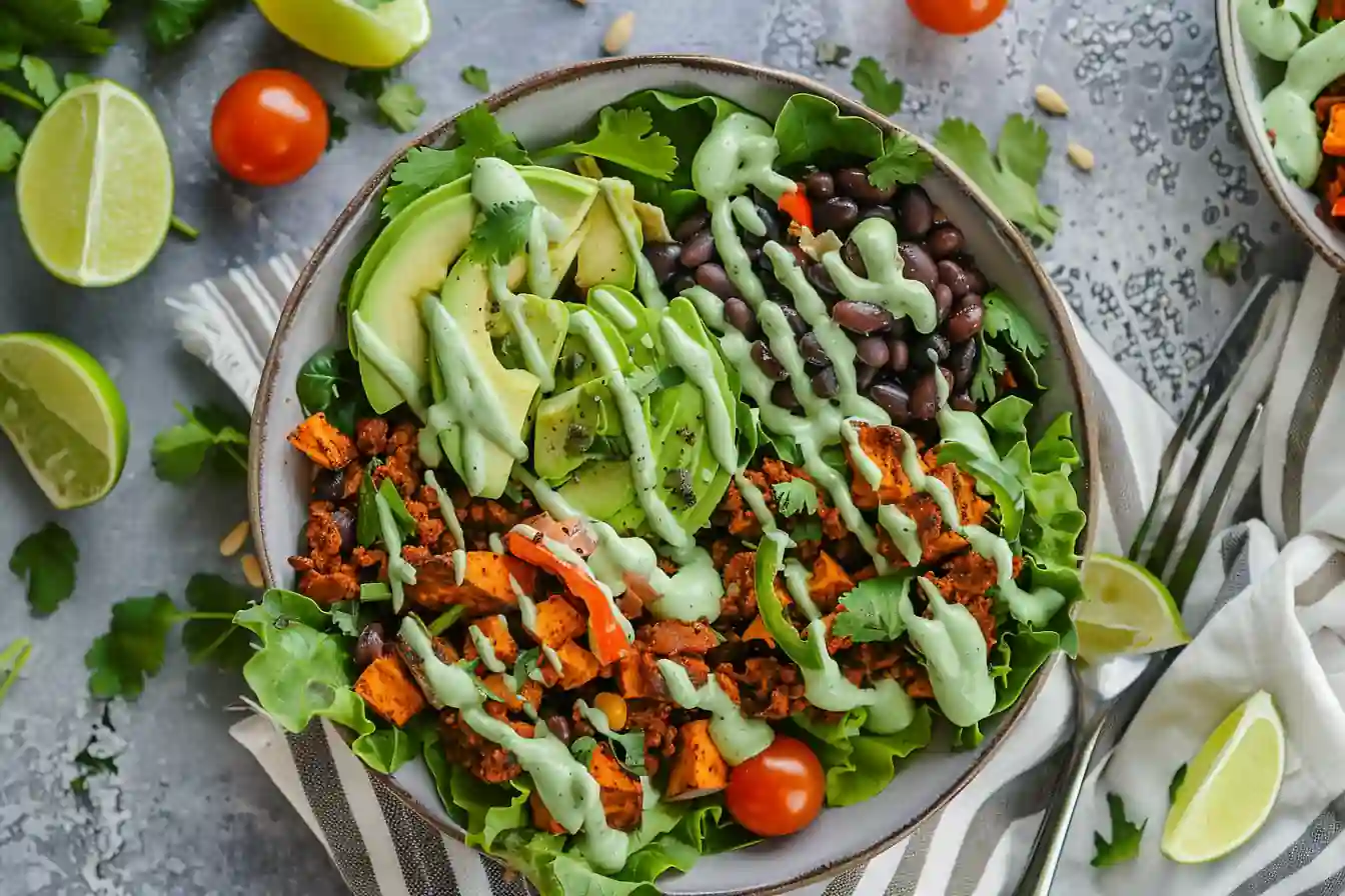 Sweet Potato Taco Bowl with avocado, black beans, and cilantro lime dressing