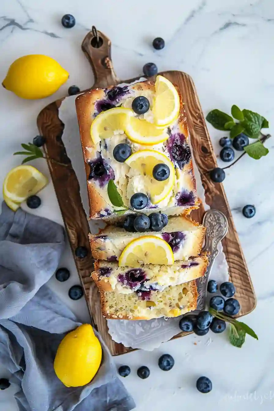 lemon blueberry cottage cheese loaf sliced on board